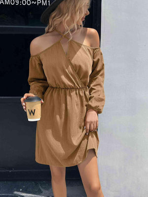 a woman in a brown dress holding a cup of coffee