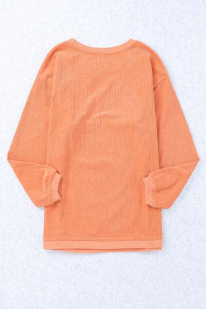 a picture of an orange shirt on a white background