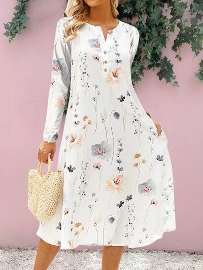 a woman wearing a white floral print dress