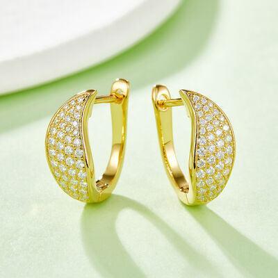 a pair of gold hoop earrings with diamonds