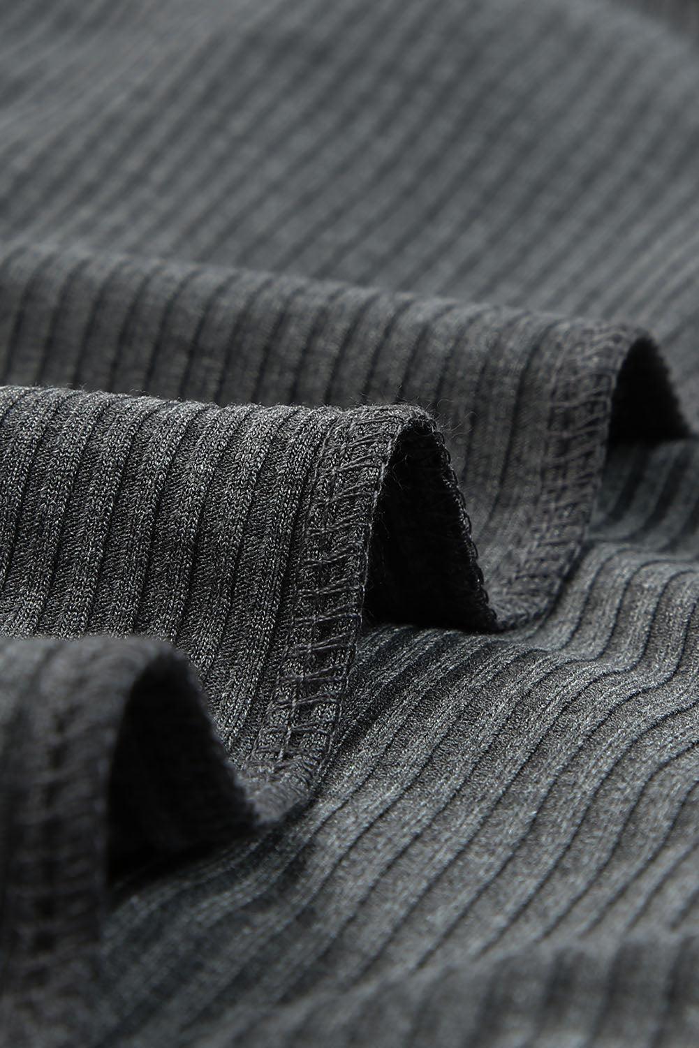 a close up of a gray sweater with a black stripe