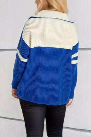 a woman wearing a blue and white sweater