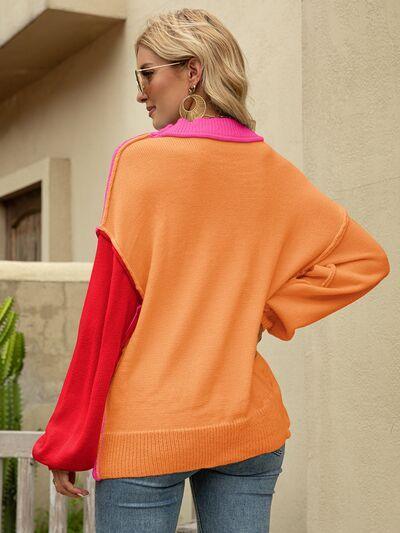 a woman wearing an orange and pink sweater