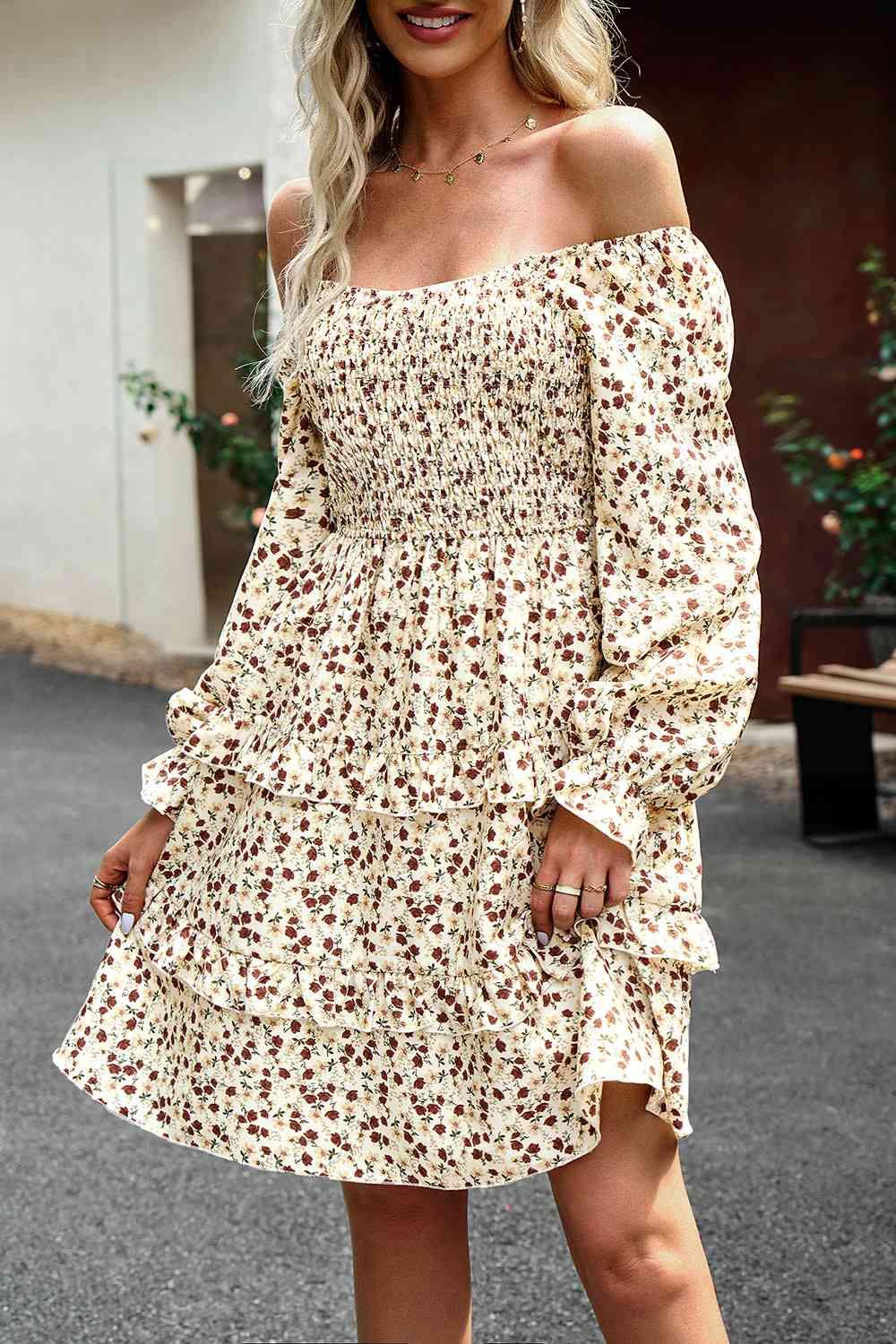 a woman wearing a white floral dress