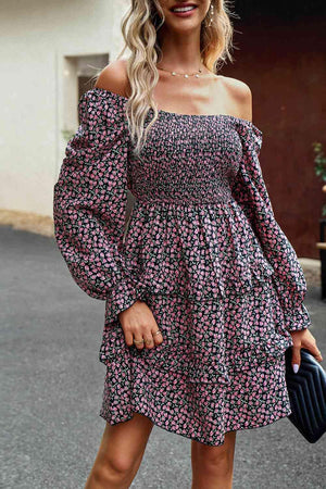 a woman in a floral print dress