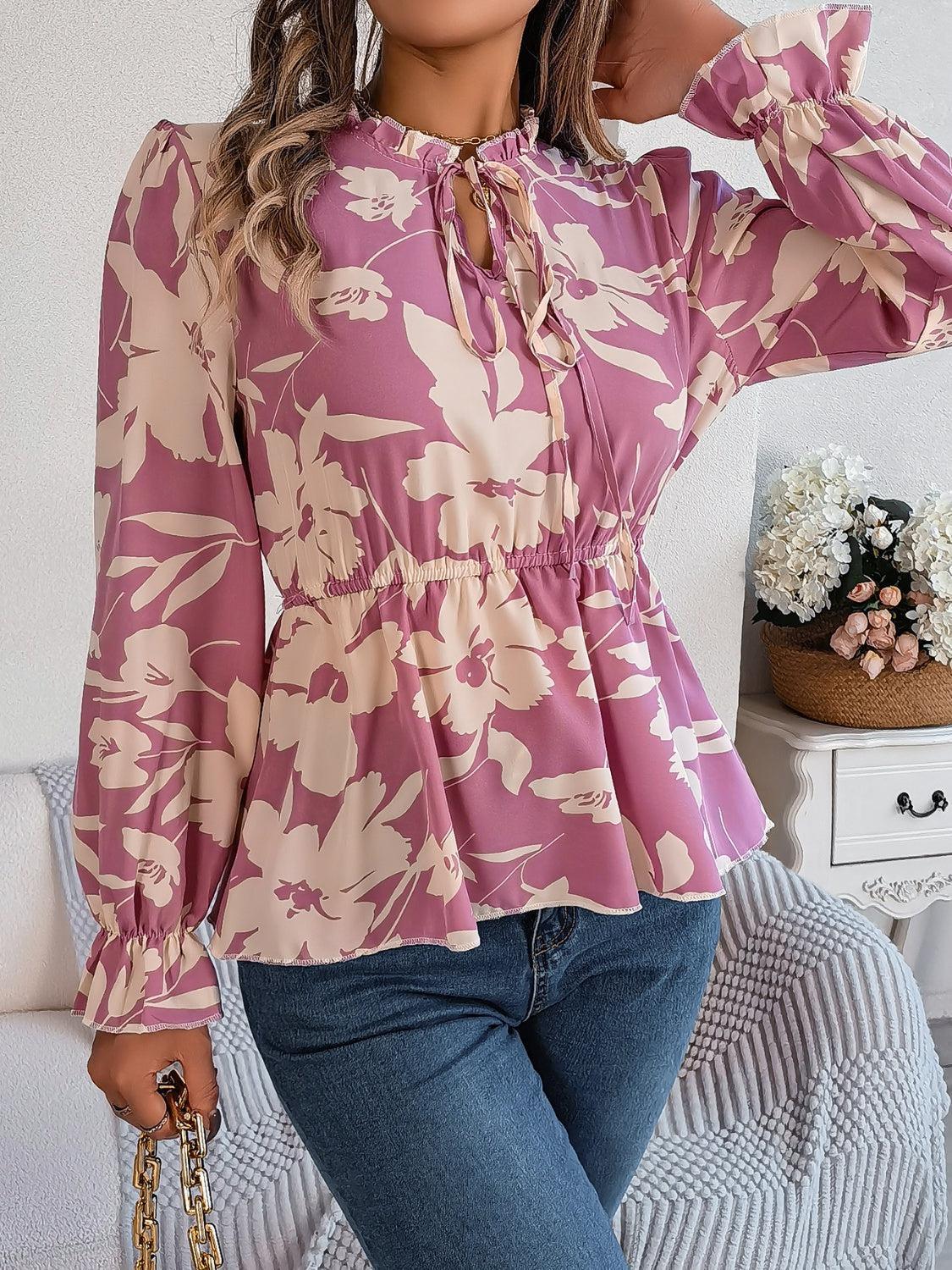 a woman wearing a pink blouse and jeans