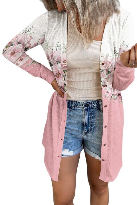 a woman wearing shorts and a pink cardigan