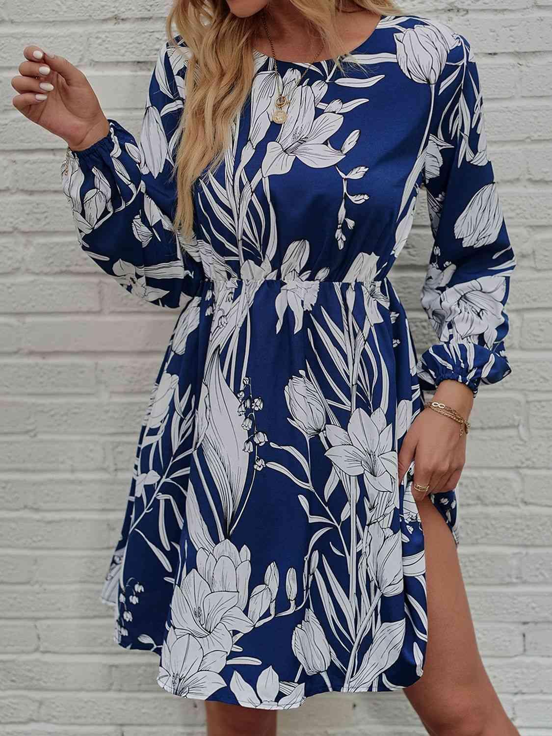 a woman wearing a blue and white floral print dress