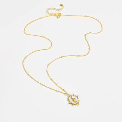 a gold necklace with a diamond pendant on a white background