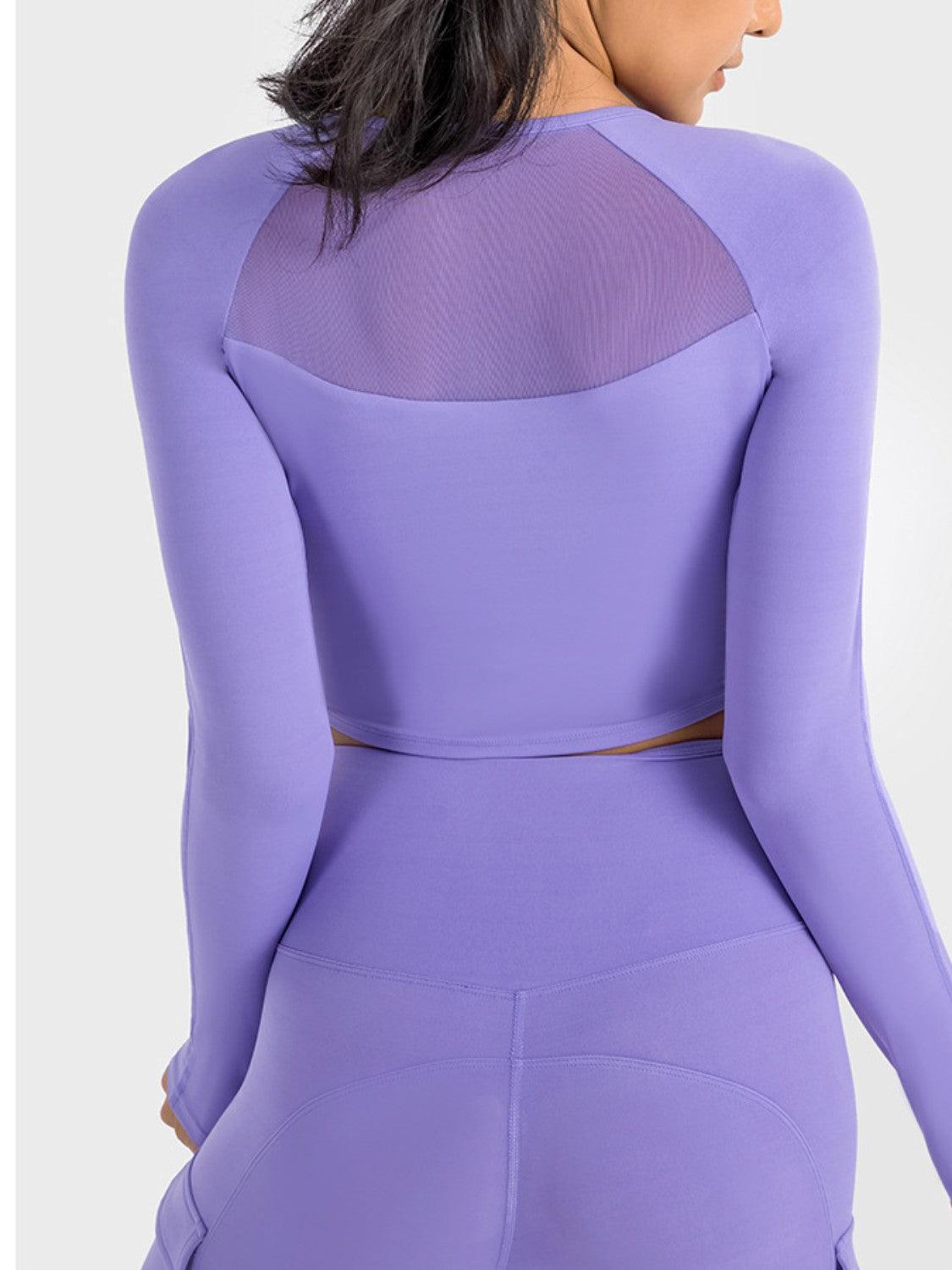 the back of a woman wearing a purple bodysuit