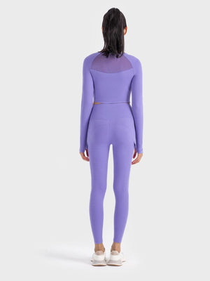 the back of a woman in a purple bodysuit