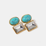 a pair of turquoise stone and crystal earrings