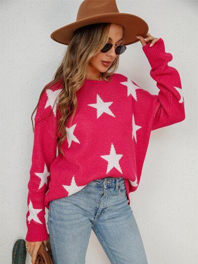 a woman wearing a pink sweater with white stars on it