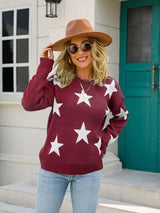 a woman wearing a star sweater and hat