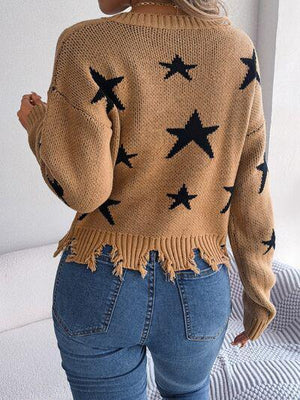 a woman wearing a sweater with stars on it