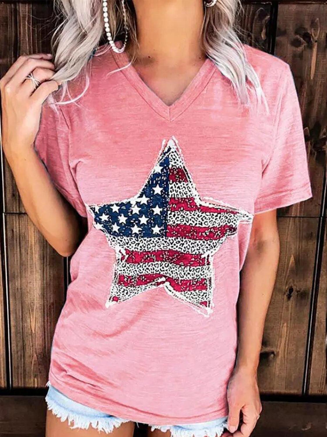 a woman wearing a pink shirt with an american flag star on it