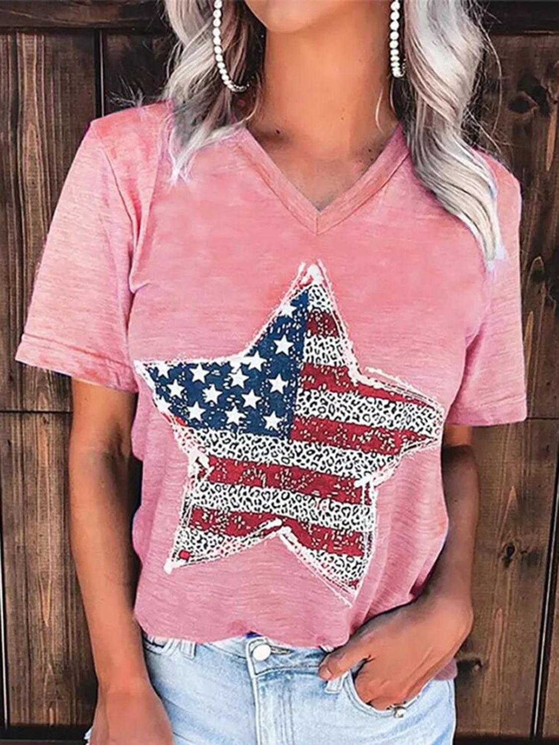 a woman wearing a pink shirt with an american flag star on it