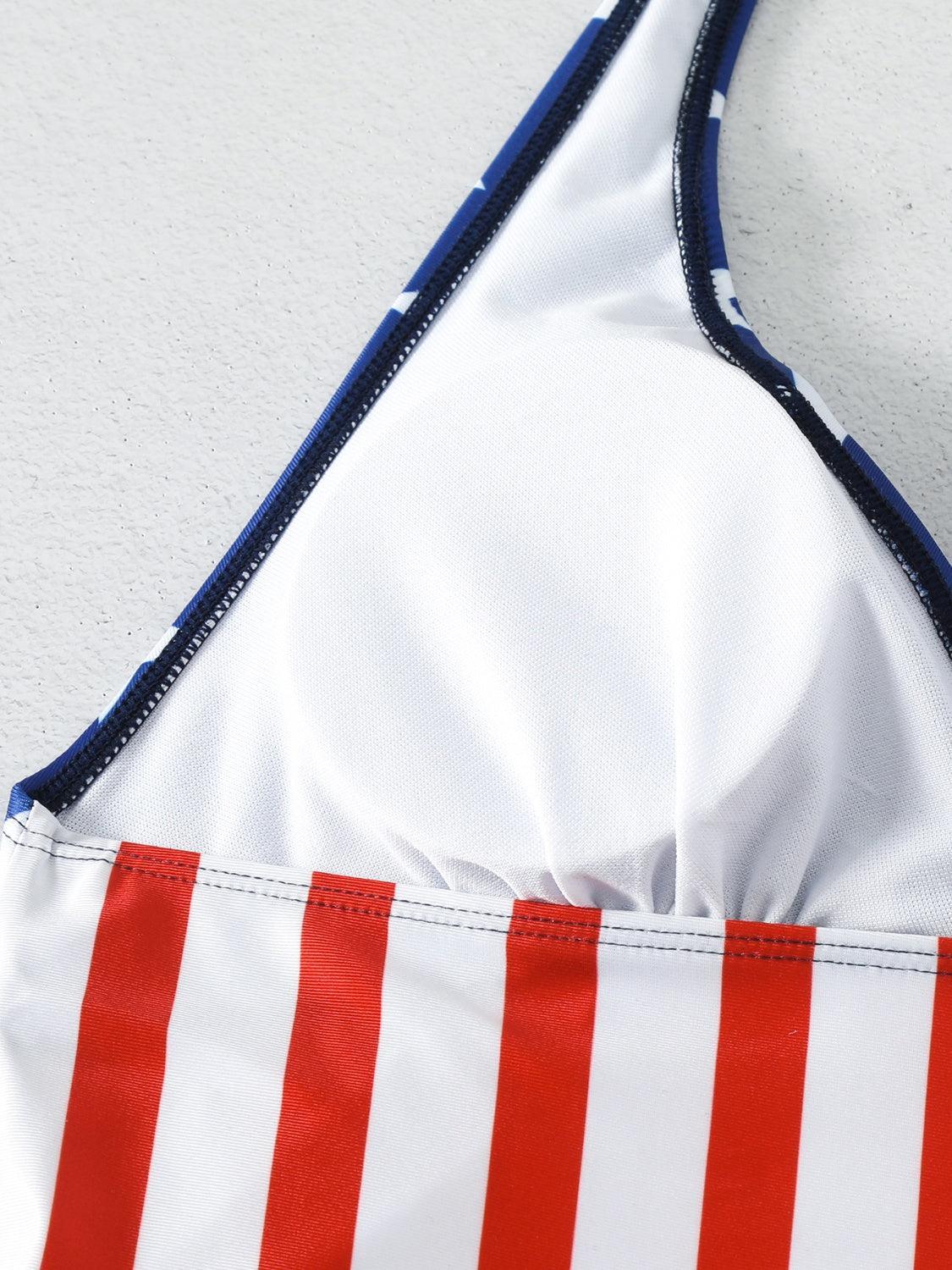 a close up of a red and white stripped bikini