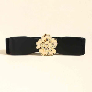 a black belt with a gold flower buckle