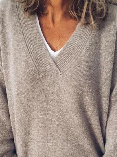 a close up of a person wearing a sweater