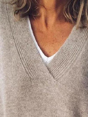 a close up of a person wearing a sweater