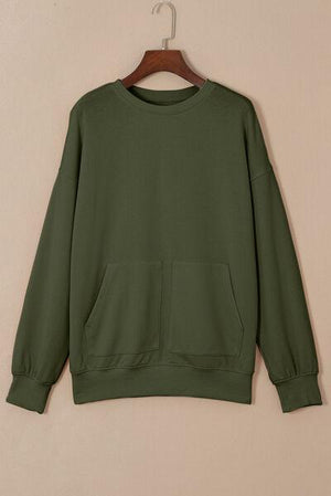 a green sweatshirt hanging on a hanger