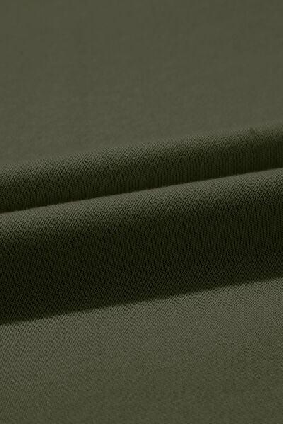 a close up shot of a plain green fabric