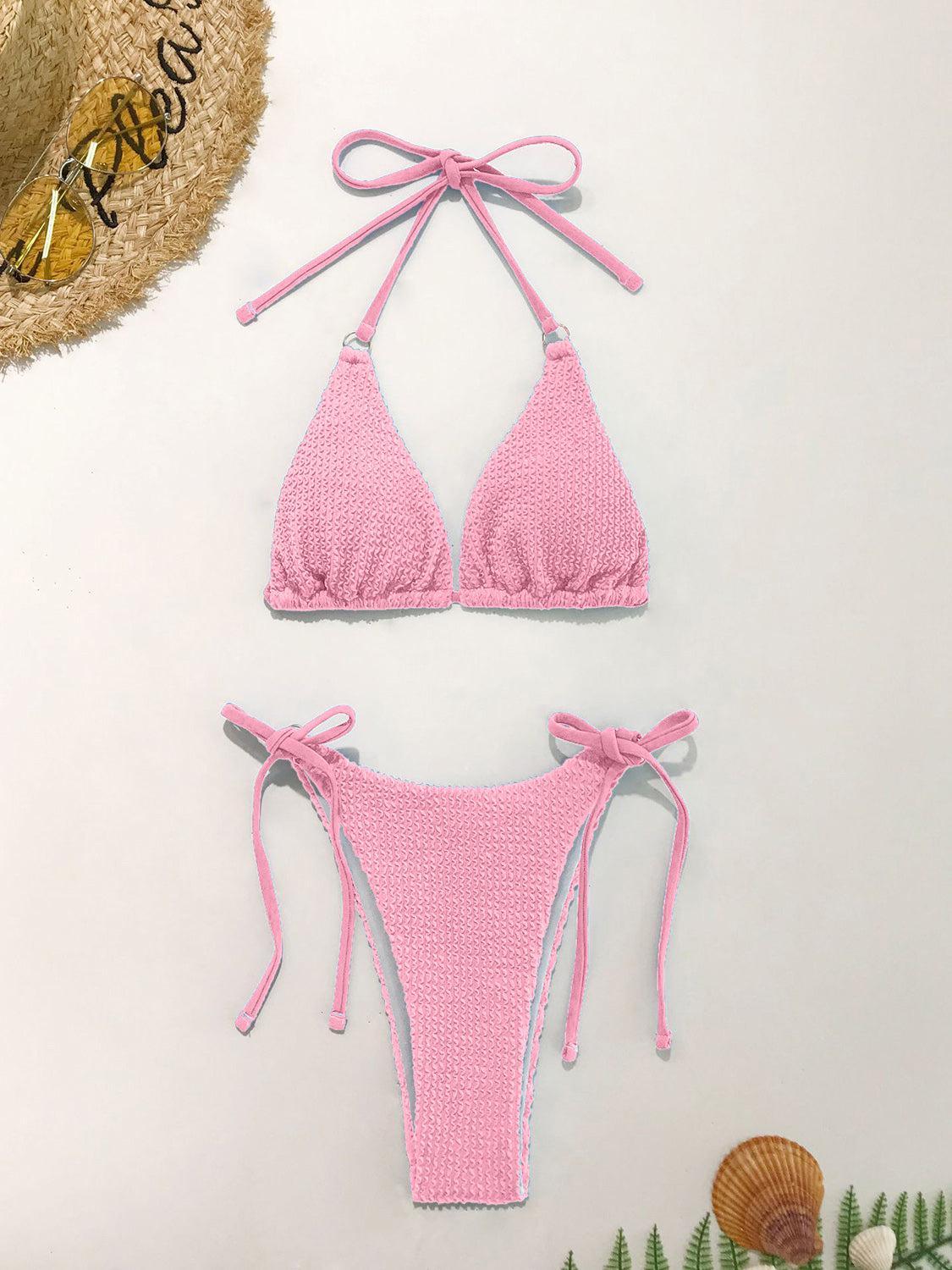 a pink bikini top and bottom with ties
