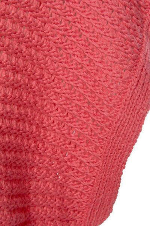 a close up of a red sweater on a white background
