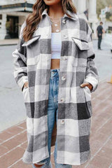 a woman wearing a plaid coat and ripped jeans