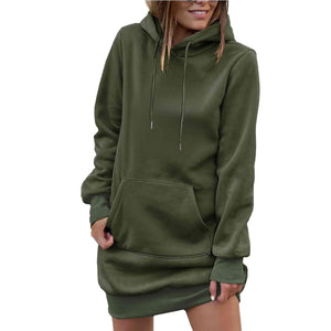 a woman wearing a green sweatshirt dress