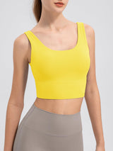 a woman wearing a yellow crop top