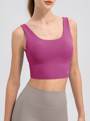 a woman in a pink sports bra top