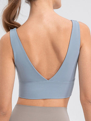 a woman wearing a gray sports bra top