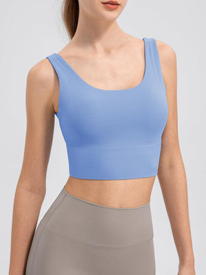 a woman wearing a light blue crop top