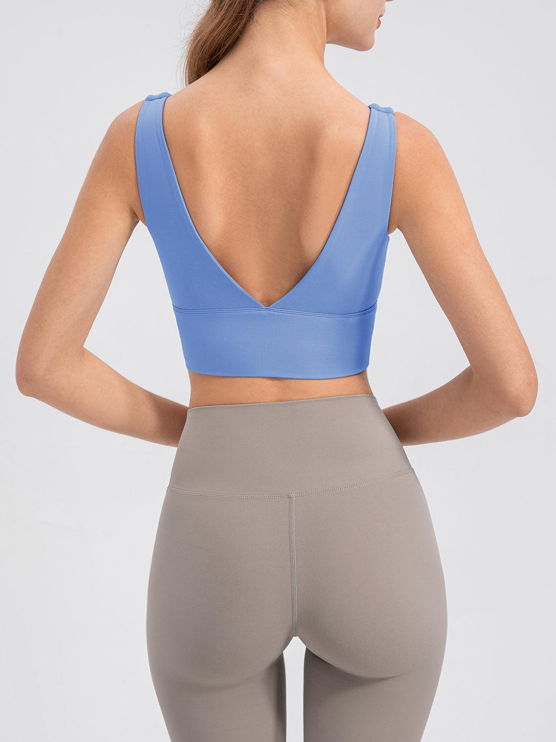 the back of a woman in a blue sports bra top