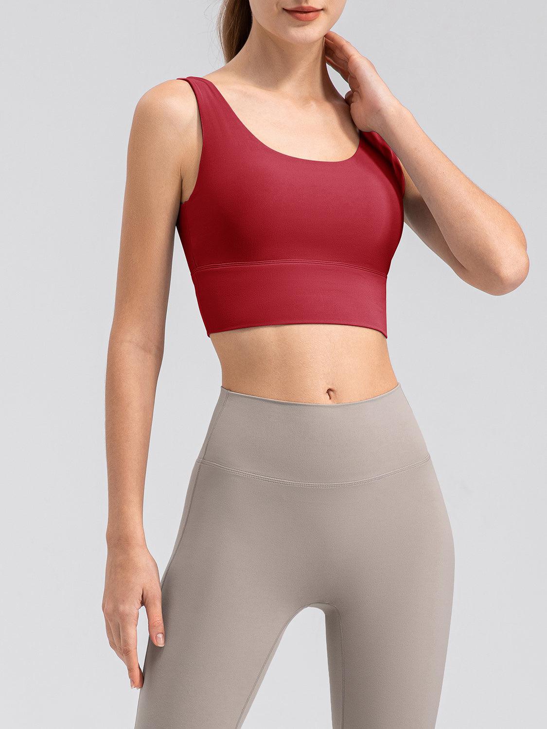 a woman wearing a red sports bra top