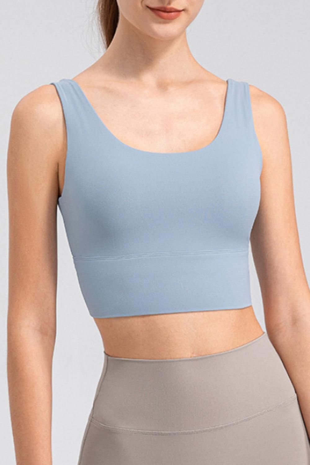 a woman wearing a light blue crop top