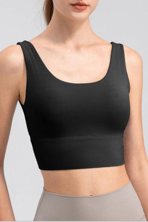 a woman wearing a black bra top