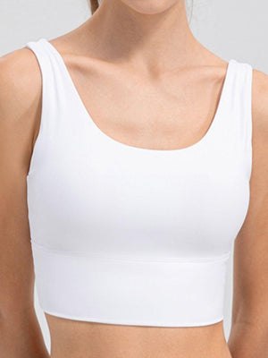 a woman wearing a white sports bra top