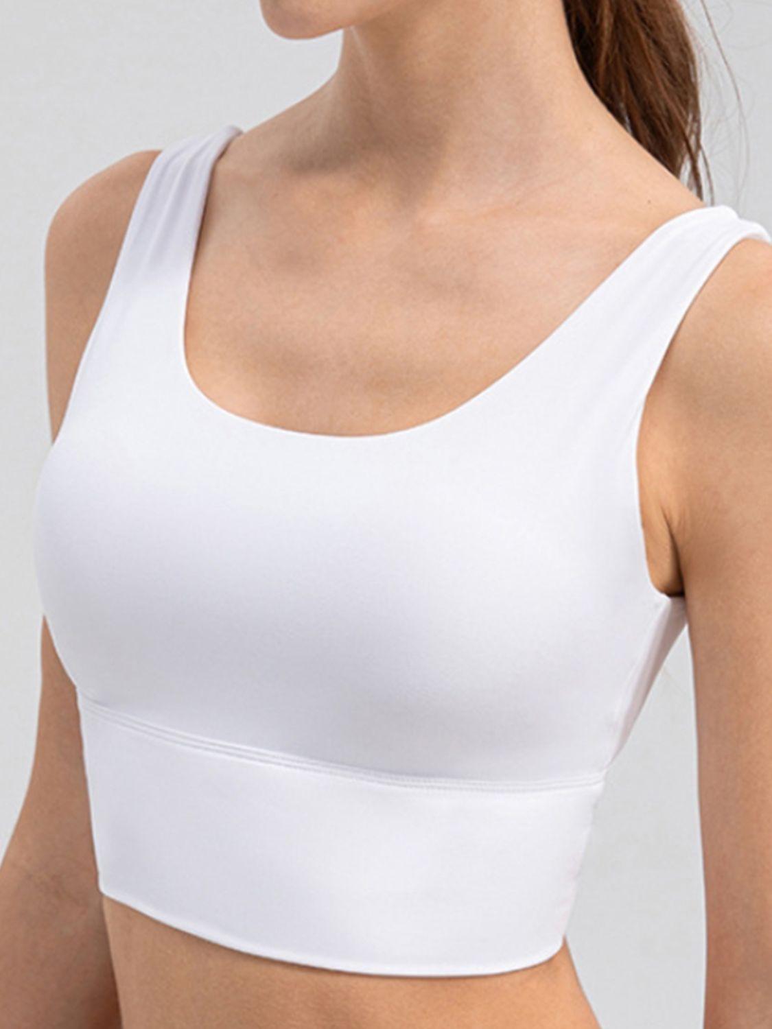 a woman wearing a white sports bra top