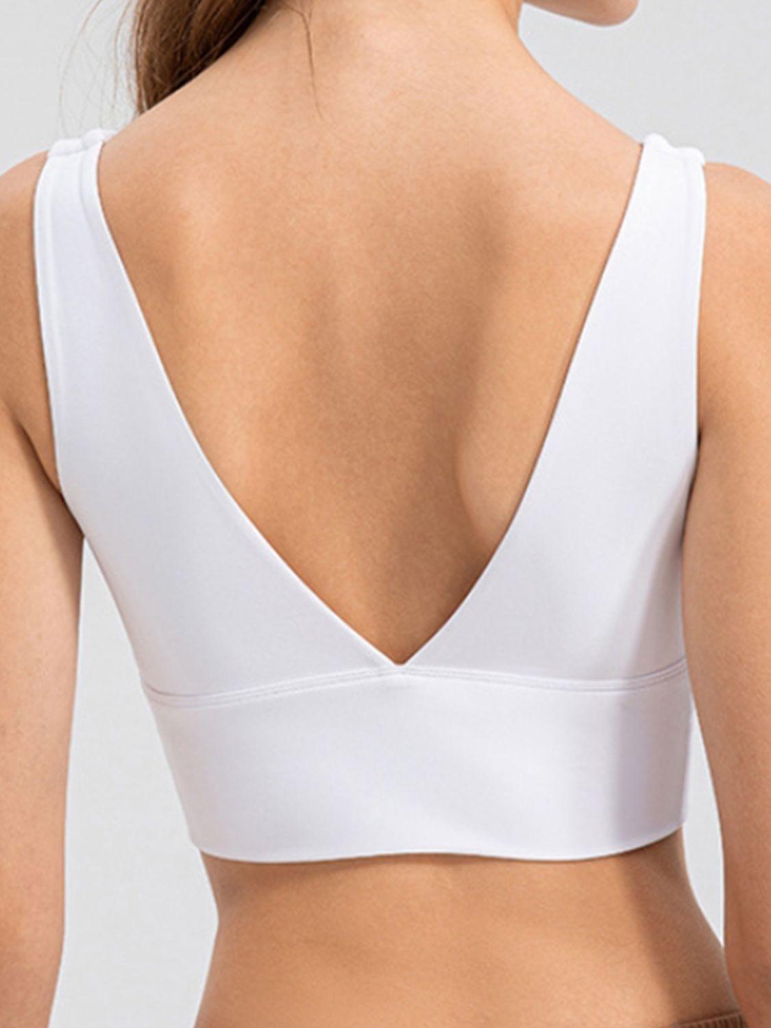 the back of a woman wearing a white bra