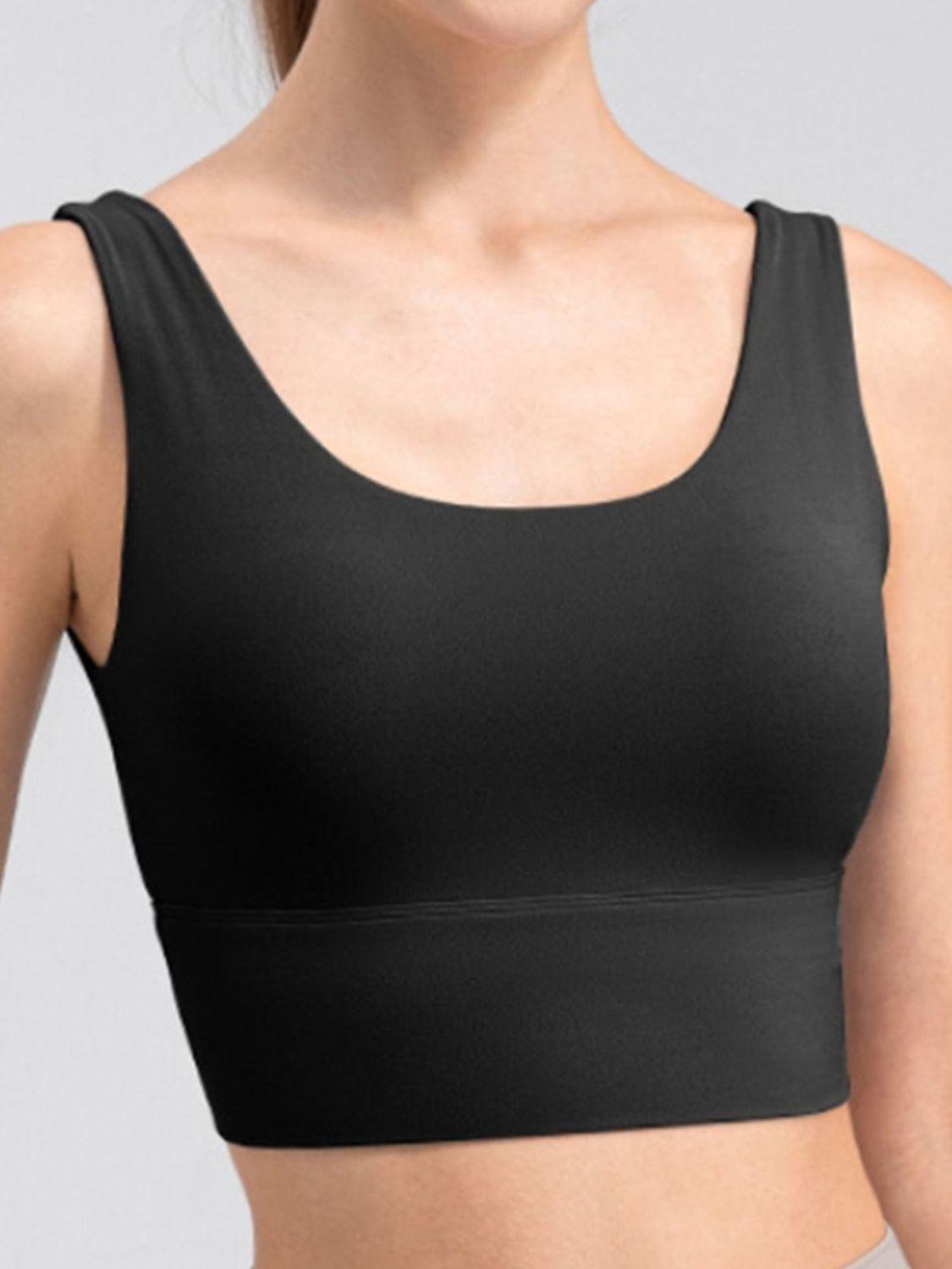 a woman wearing a black sports bra top