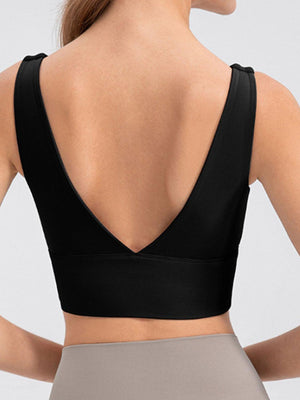 the back of a woman wearing a black bra