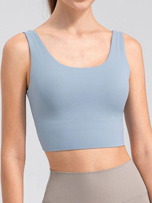 a woman wearing a light blue crop top