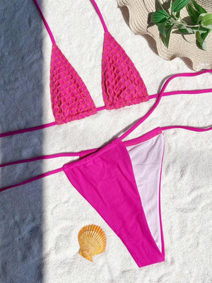 a bikini top and a bikini bottom laying on a towel
