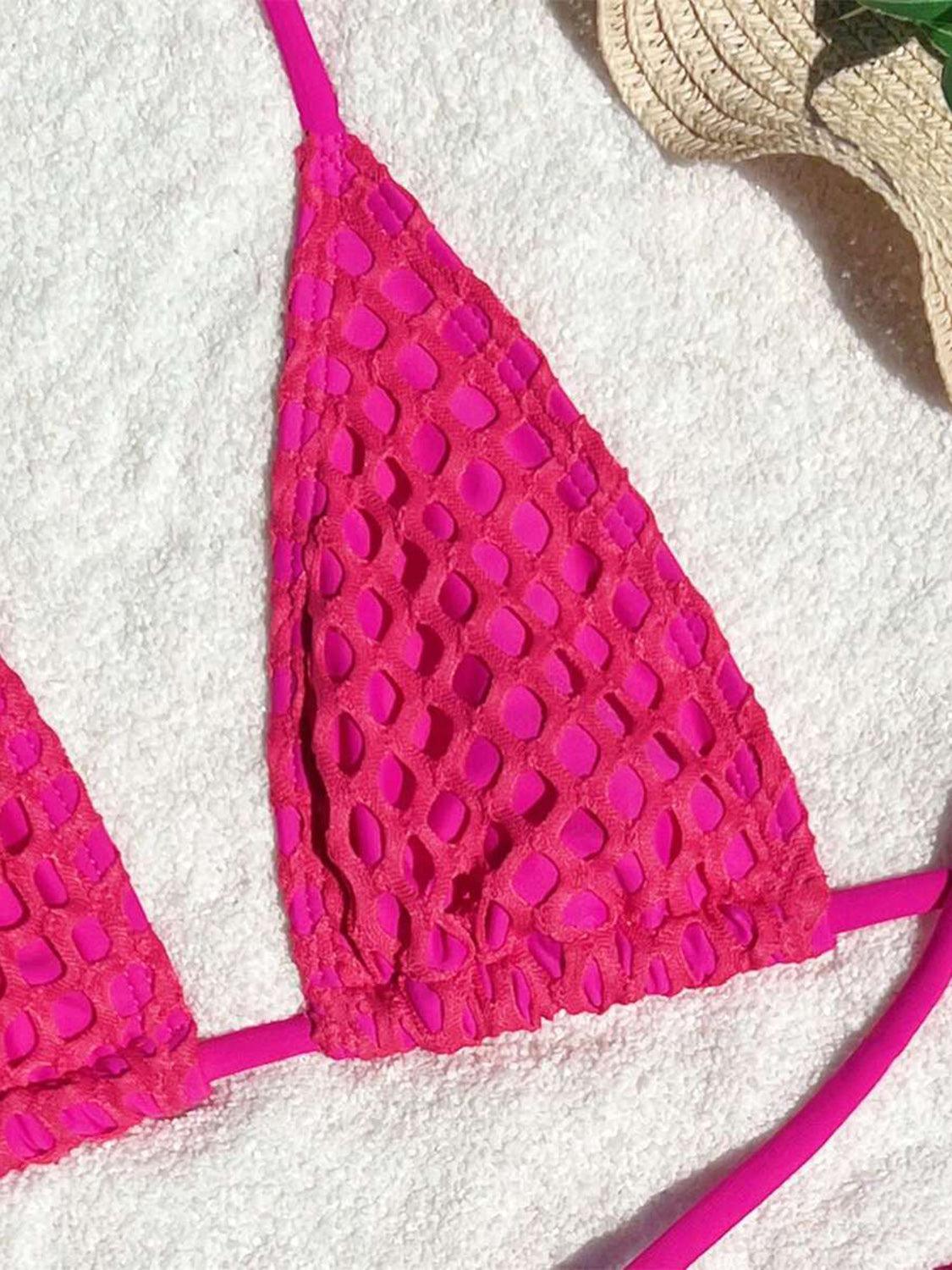 a close up of a bikini top on a towel