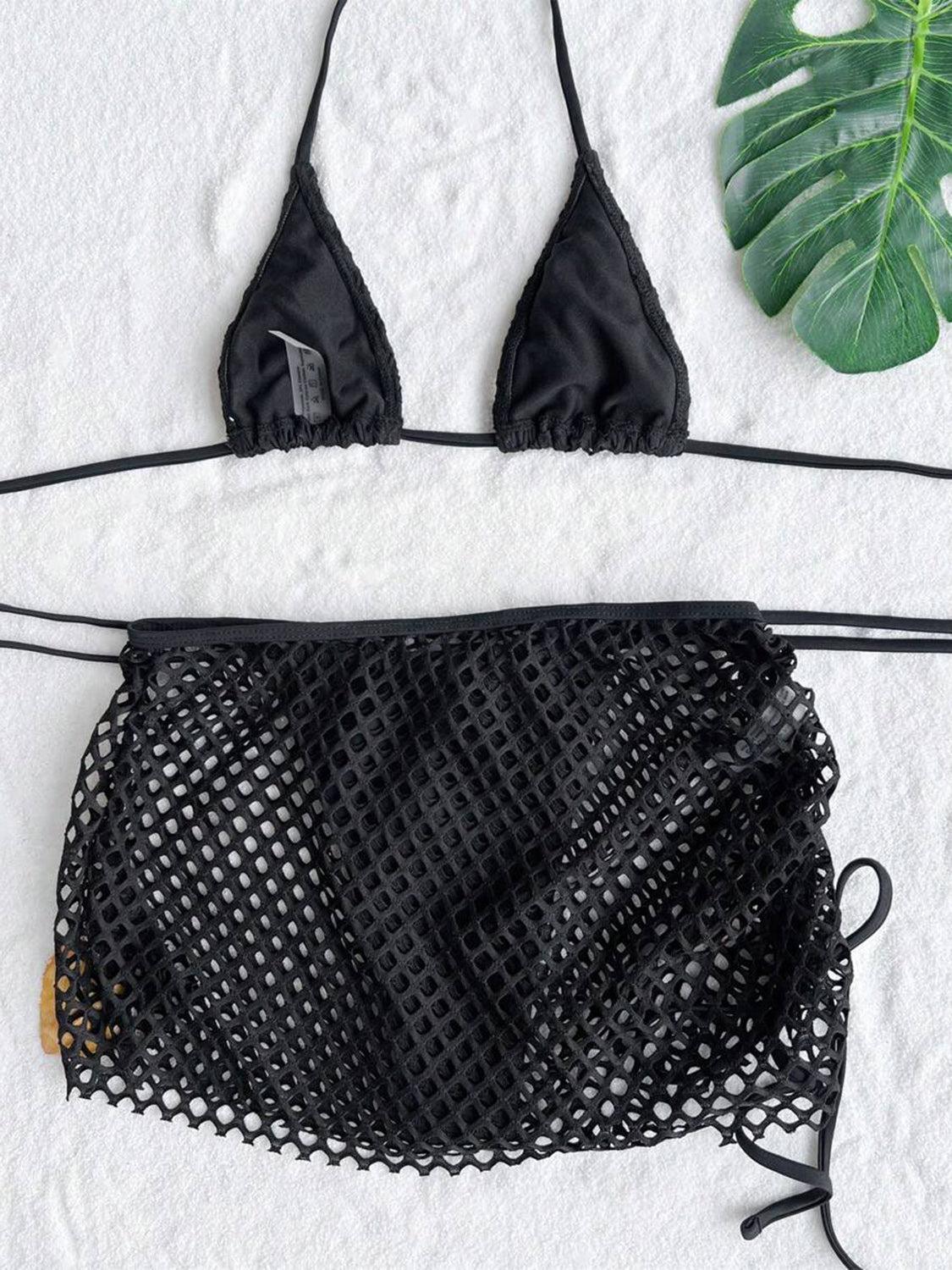 a black bikini top and a black net bag