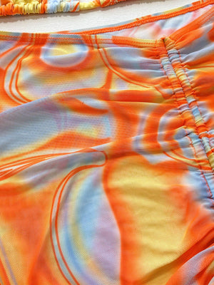 a close up of a tie dyed shorts