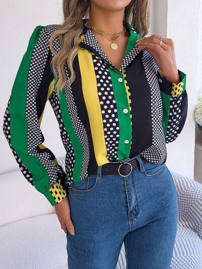 a woman wearing a colorful shirt and jeans